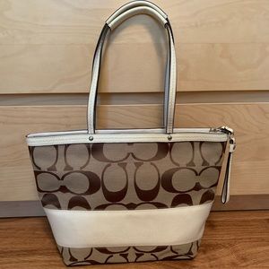 The Coach Signature Collection shoulder tote bag.